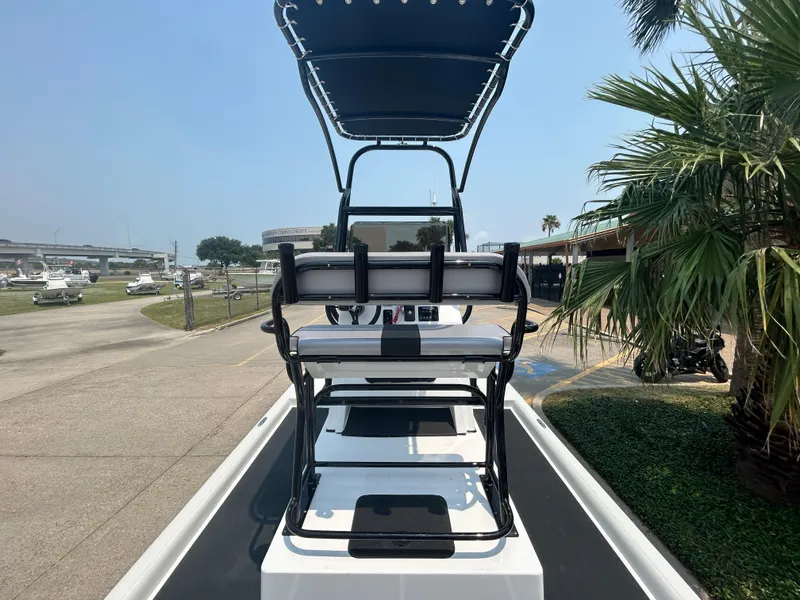 Slide: The Image of 2025 Shallow Stalker 240 RC Elite boat with elevated seating and canopy. - 6