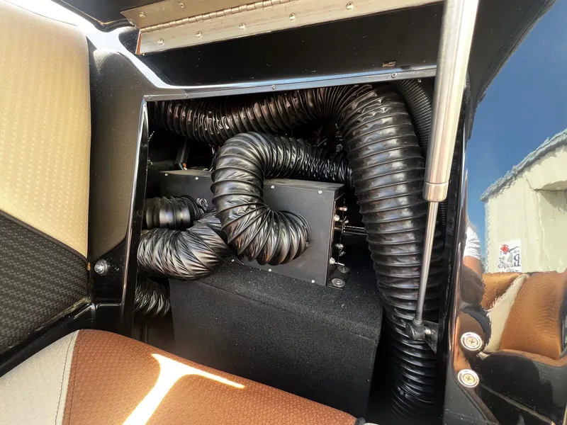Slide: The Image of 2021 Centurion Ri245 engine compartment with black hoses and components. - 15