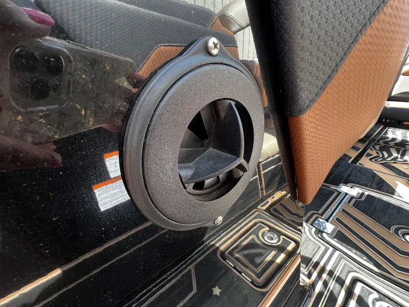 Slide: The Image of Close-up of a 2021 Centurion Ri245 boat's black exterior and vent. - 17