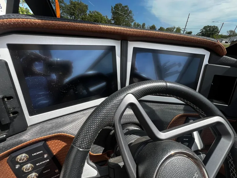 Slide: The Image of 2021 Centurion Ri245 dashboard with dual touchscreen displays and steering wheel. - 18