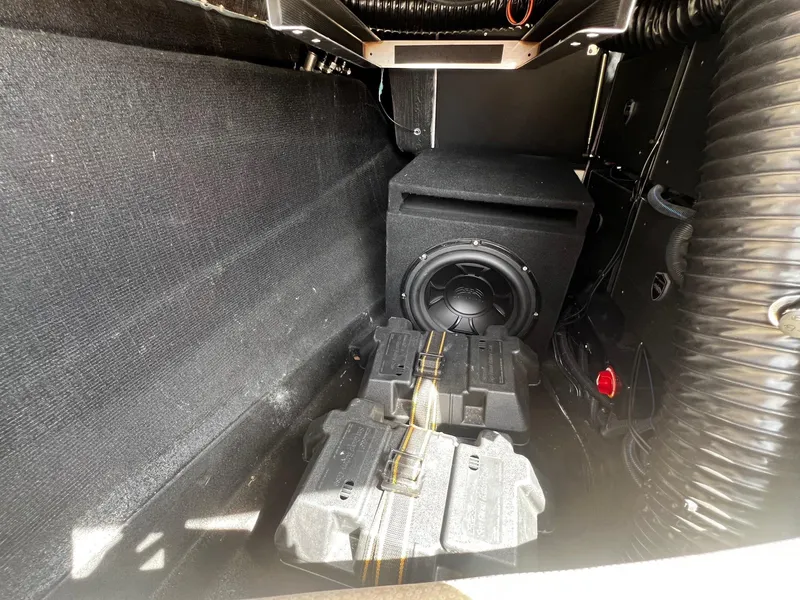 Slide: The Image of 2021 Centurion Ri245 storage compartment with subwoofer and battery packs. - 19