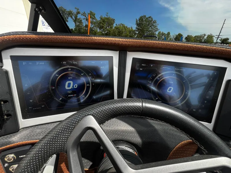 Slide: The Image of 2021 Centurion Ri245 dashboard with dual digital displays and steering wheel. - 24