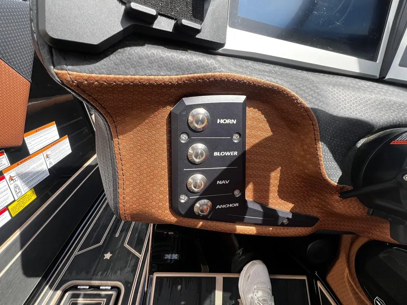 Slide: The Image of Control panel of a 2021 Centurion Ri245 boat with horn, blower, nav, and anchor switches. - 26