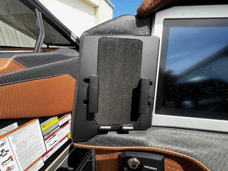 Slide: The Image of 2021 Centurion Ri245 boat dashboard with touchscreen and control panel. - 27