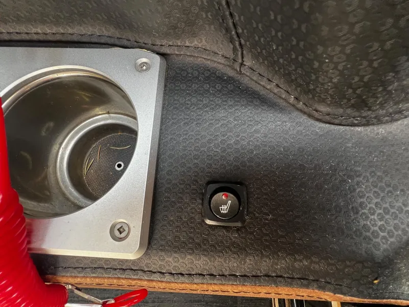 Slide: The Image of Centurion Ri245 2021 boat interior with cup holder and seat heater switch. - 28