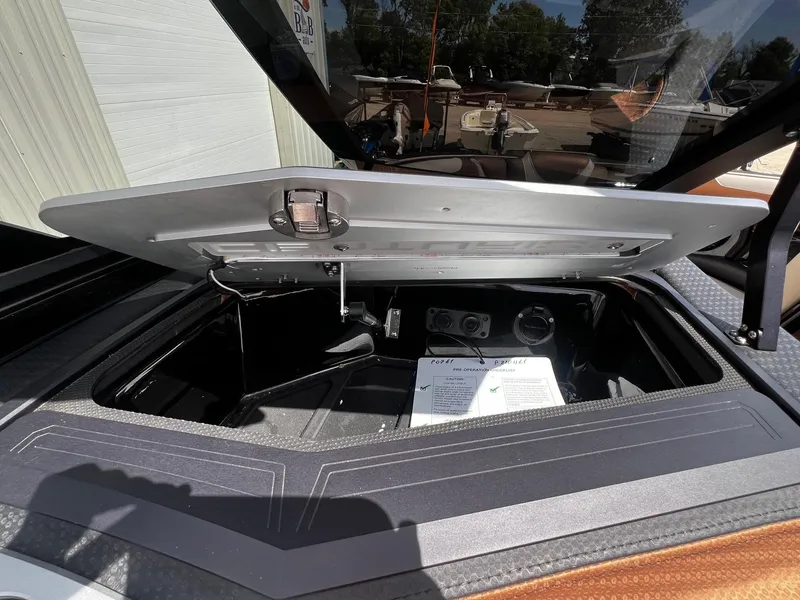 Slide: The Image of Open storage compartment of a 2021 Centurion Ri245 boat. - 29