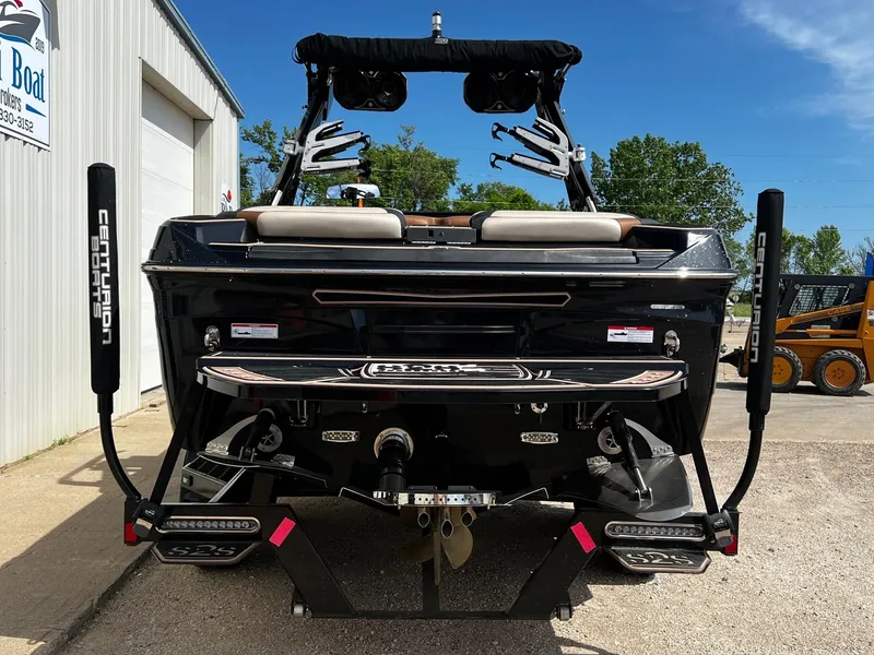 Slide: The Image of 2021 Centurion Ri245 boat rear view with wakeboard tower and swim platform. - 7