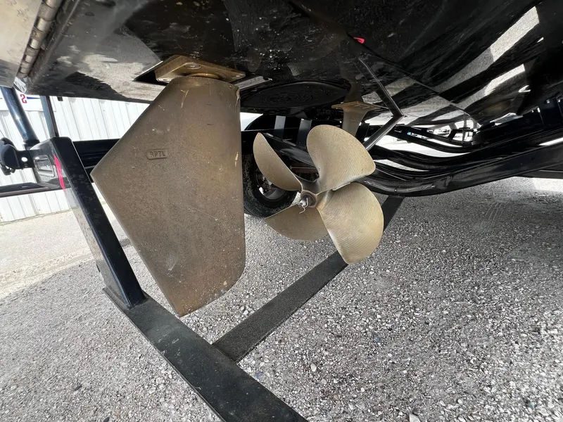 Slide: The Image of Close-up of the propeller and rudder of a 2021 Centurion Ri245 boat. - 8