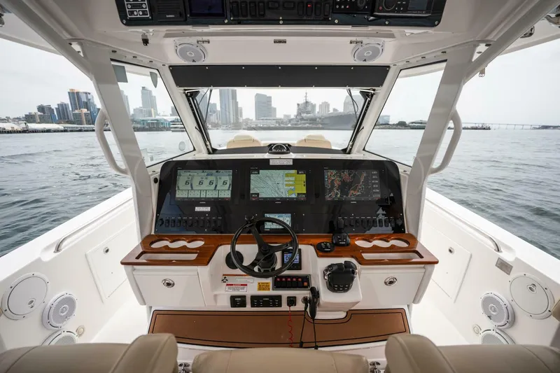 Slide: The Image of 2019 Everglades 435 Center Console boat cockpit with advanced navigation systems. - 18