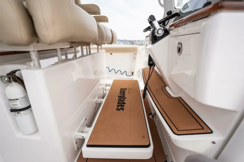 Slide: The Image of 2019 Everglades 435 Center Console boat interior with seating and deck details. - 20