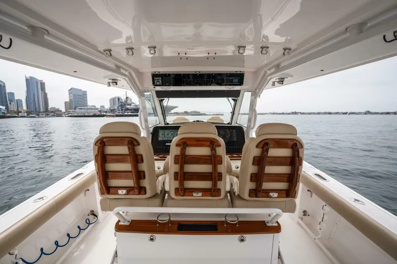 Slide: The Image of 2019 Everglades 435 Center Console boat interior with city skyline in background. - 22