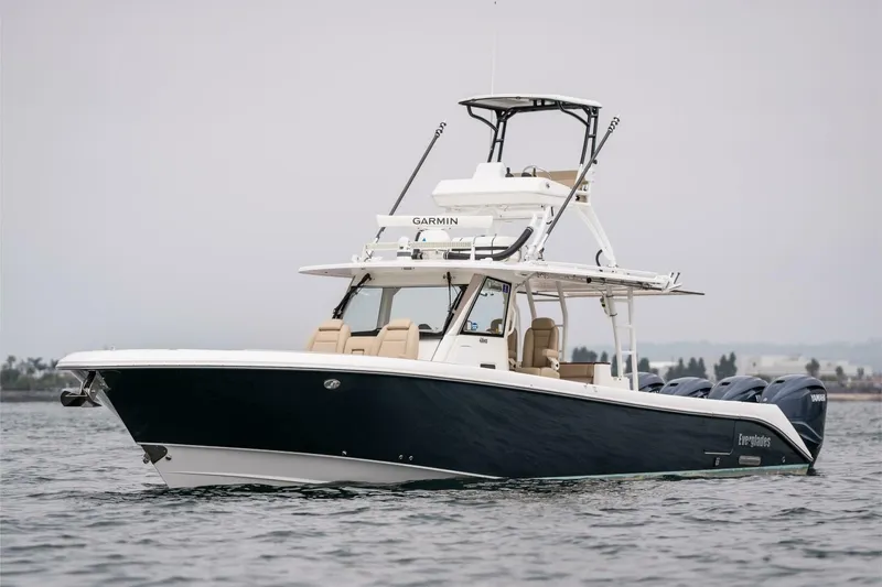 Slide: The Image of 2019 Everglades 435 Center Console boat on water with Garmin equipment. - 3