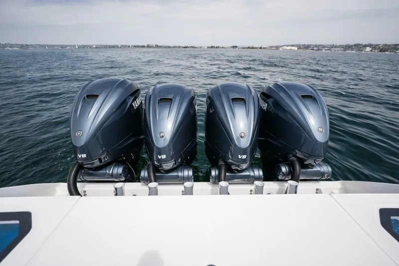 Slide: The Image of 2019 Everglades 435 Center Console with four Yamaha V8 outboard engines on the water. - 30