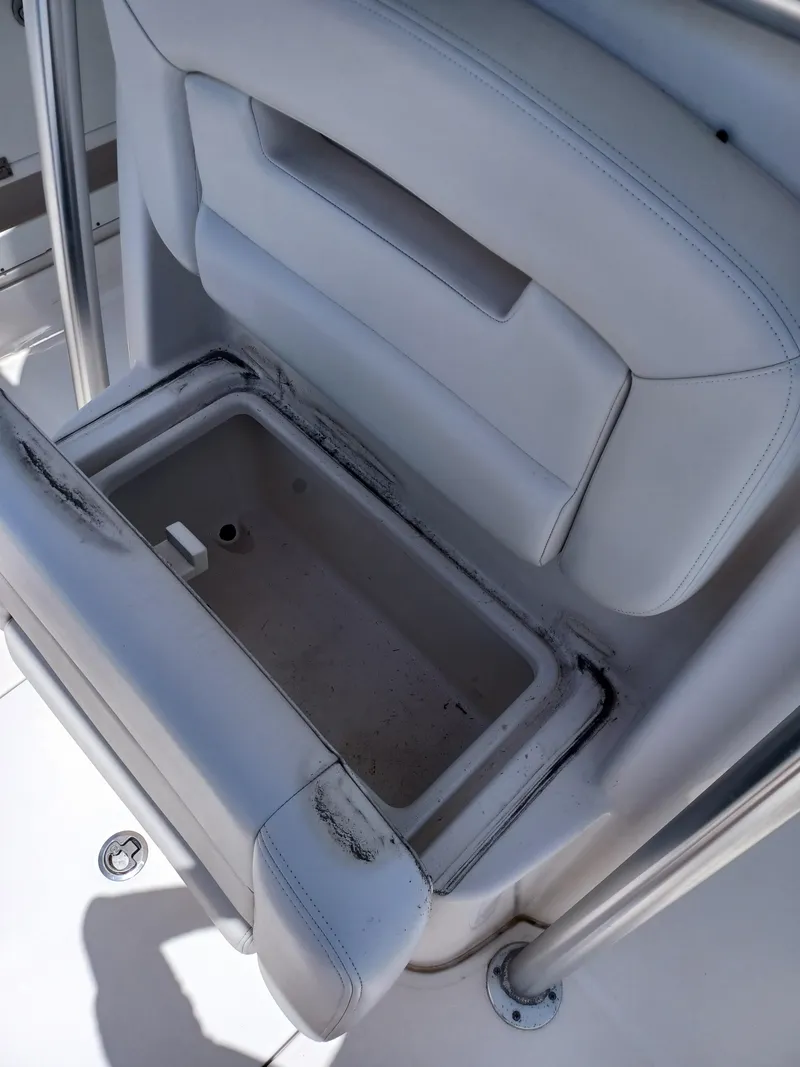 Slide: The Image of 2016 Robalo R300 Center Console seat storage compartment. - 20