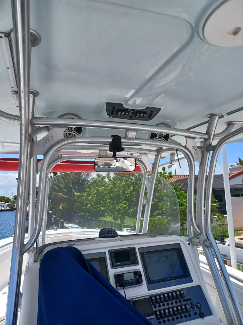 Slide: The Image of 2016 Robalo R300 Center Console boat interior with navigation equipment and controls. - 9