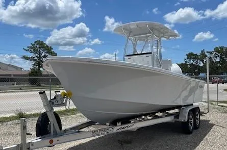 The Image of 2025 Pair Customs 21MV boat on a trailer under a partly cloudy sky. - 1