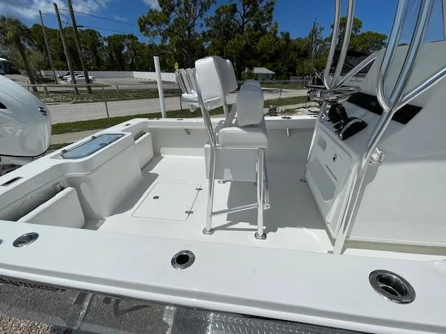 Slide: The Image of 2025 Pair Customs 21MV boat interior with seating and control console. - 11