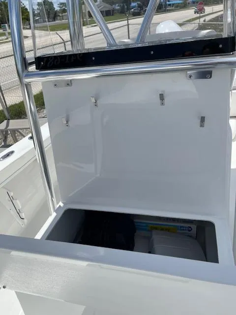 Slide: The Image of 2025 Pair Customs 21MV boat storage compartment with open hatch. - 25