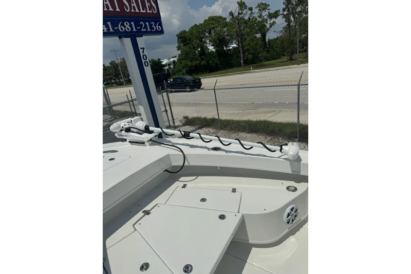 Slide: The Image of 2025 Pair Customs 21MV boat deck with Garmin equipment, parked near a road. - 35