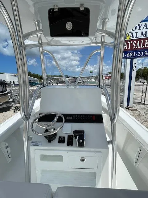 Slide: The Image of 2025 Pair Customs 21MV boat dashboard with steering wheel and controls. - 13