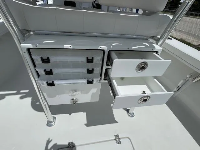 Slide: The Image of Pair Customs 21MV 2025 boat storage compartments with drawers and tackle boxes. - 16