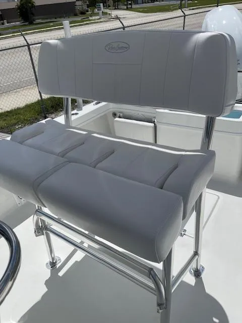 Slide: The Image of 2025 Pair Customs 21MV boat seat with white cushioned upholstery and stainless steel frame. - 19