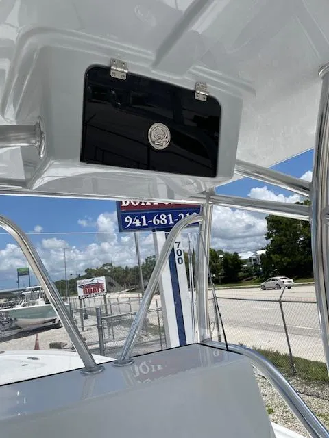 Slide: The Image of 2025 Pair Customs 21MV boat with stainless steel frame and storage compartment. - 21