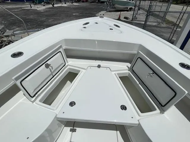 Slide: The Image of 2025 Pair Customs 21MV boat with open storage compartments. - 26