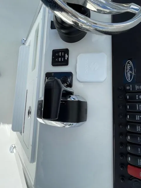 Slide: The Image of Control panel of Pair Customs 21MV boat, 2025 model, featuring steering wheel and switches. - 29