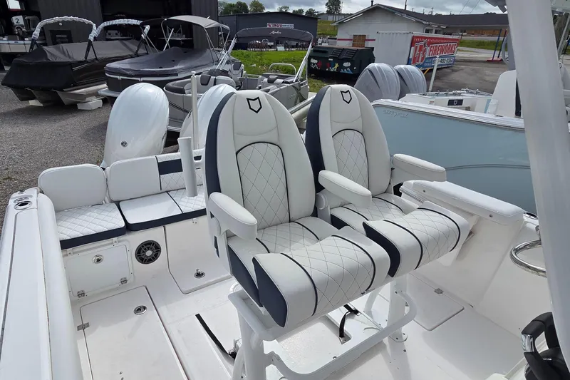Slide: The Image of 2025 Sea Fox 268 Commander boat interior with dual cushioned seats and sleek design. - 2