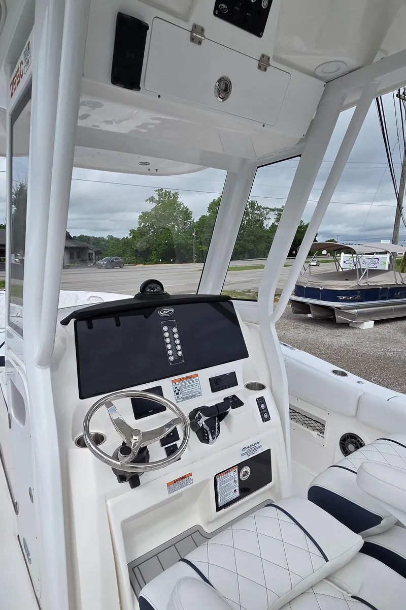 Slide: The Image of 2025 Sea Fox 268 Commander boat cockpit with modern steering and controls. - 3