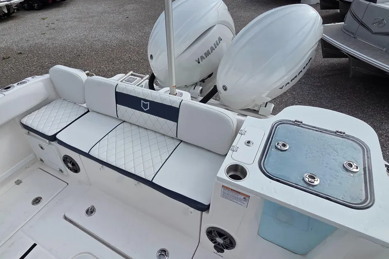 Slide: The Image of 2025 Sea Fox 268 Commander boat interior with Yamaha engines and cushioned seating. - 4