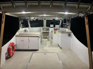 Slide: The Image of 1989 Markley 35 Ft. Deadrise boat interior with cabinets and life preserver. - 14