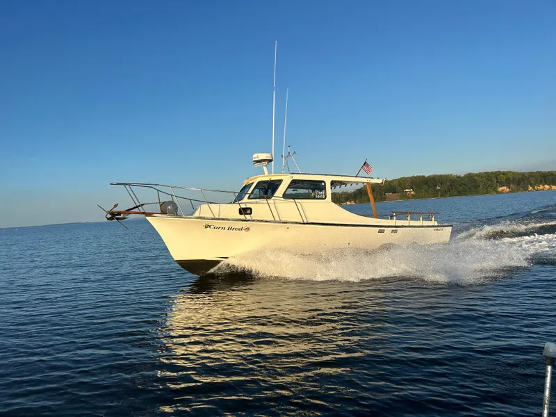 Slide: The Image of 1998 Markley 35 Ft. Deadrise boat cruising on a sunny day. - 2