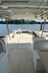 Slide: The Image of 1989 Markley 35 Ft. Deadrise boat interior with open deck and waterfront view. - 20