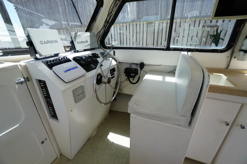 Slide: The Image of Interior of 1989 Markley 35 Ft. Deadrise boat with Garmin and Lowrance navigation systems. - 25