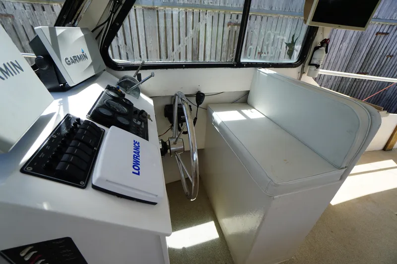Slide: The Image of Interior of a 1989 Markley 35 Ft. Deadrise boat with navigation equipment. - 26