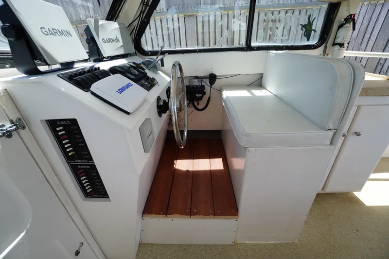 Slide: The Image of Interior of 1989 Markley 35 Ft. Deadrise boat with Garmin navigation equipment. - 31
