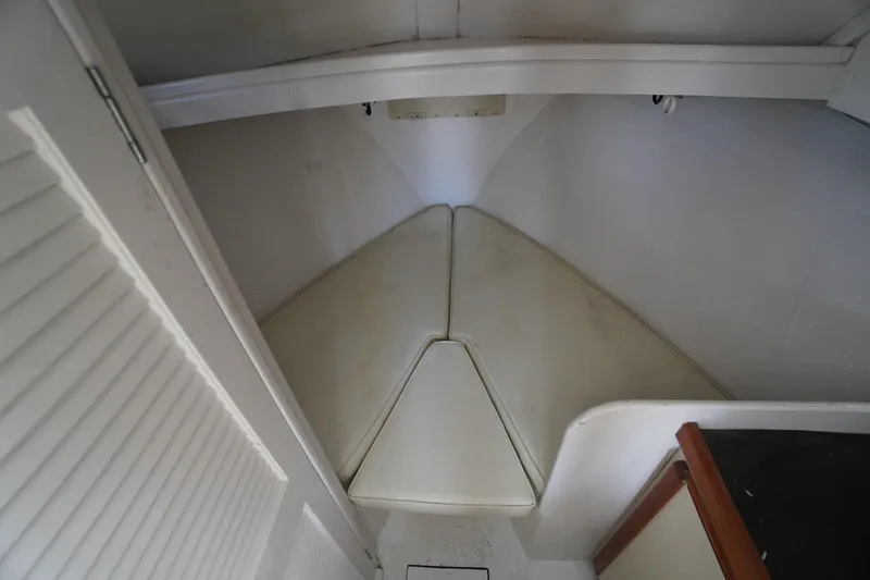 Slide: The Image of Interior cabin of 1989 Markley 35 Ft. Deadrise boat with white cushions. - 33