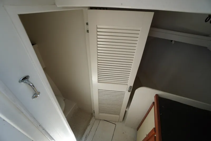 Slide: The Image of Interior of 1989 Markley 35 Ft. Deadrise boat showing storage and cabin area. - 35