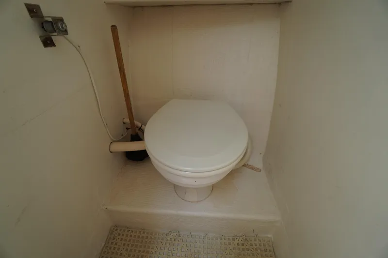 Slide: The Image of Boat bathroom with toilet on 1989 Markley 35 Ft. Deadrise. - 37