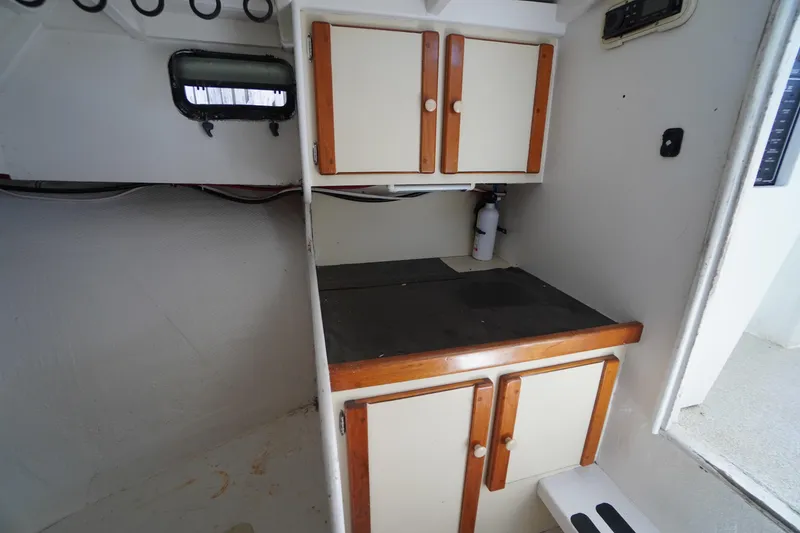 Slide: The Image of Interior of 1989 Markley 35 Ft. Deadrise boat with cabinets and countertop. - 40