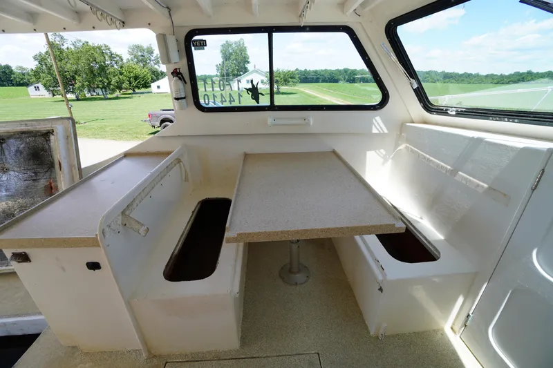 Slide: The Image of Interior of 1989 Markley 35 Ft. Deadrise boat with seating and table. - 44