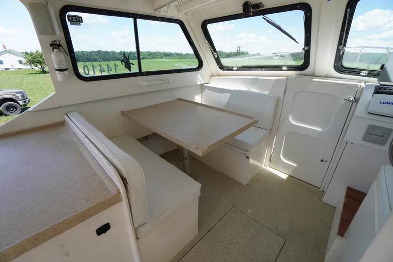 Slide: The Image of Interior of 1989 Markley 35 Ft. Deadrise boat with seating and table. - 47