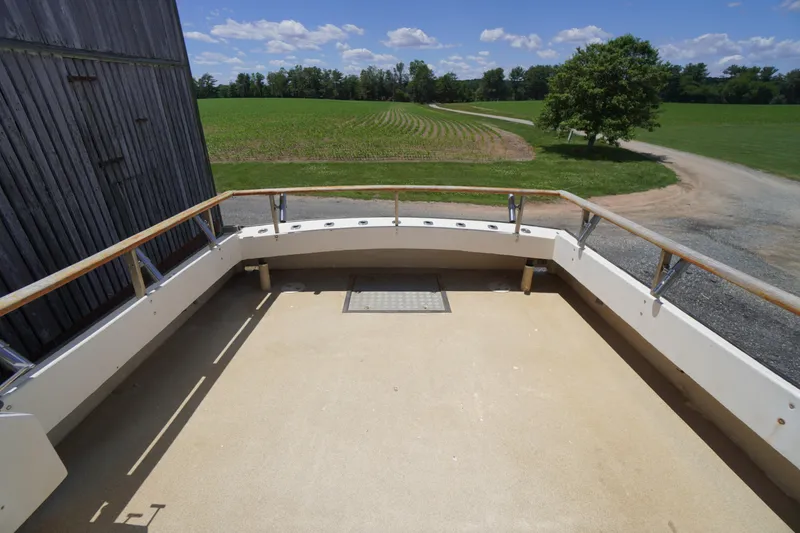 Slide: The Image of 1989 Markley 35 Ft. Deadrise boat deck with scenic rural background. - 61