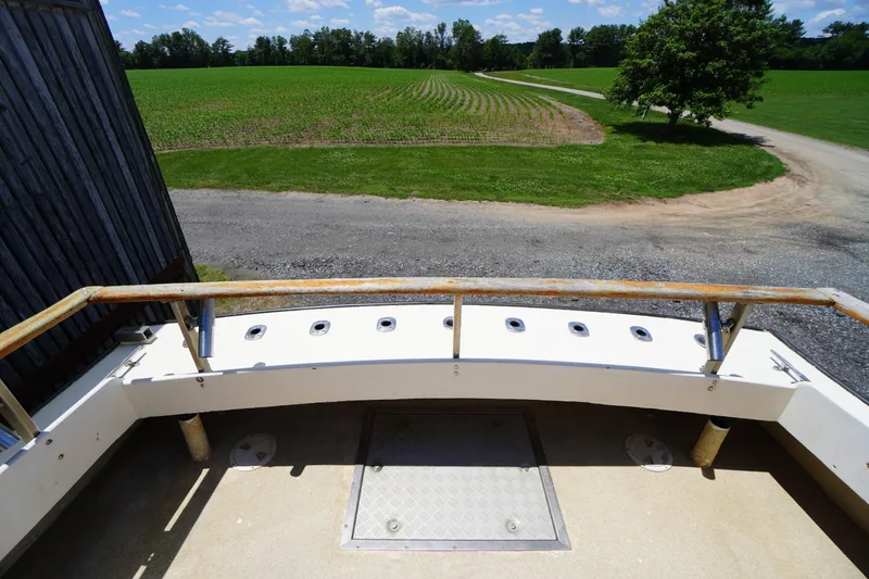 Slide: The Image of 1989 Markley 35 Ft. Deadrise boat deck overlooking a rural landscape. - 62