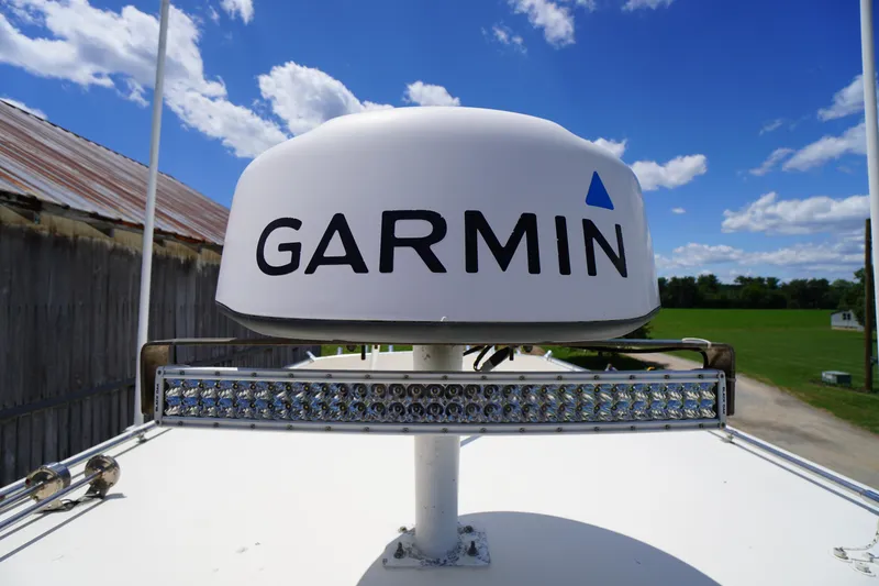 Slide: The Image of Garmin radar on 1989 Markley 35 Ft. Deadrise boat under blue sky. - 68