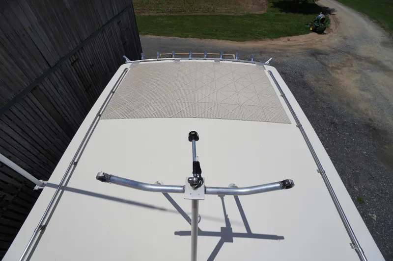 Slide: The Image of Top view of a 1989 Markley 35 Ft. Deadrise boat roof with railing. - 70