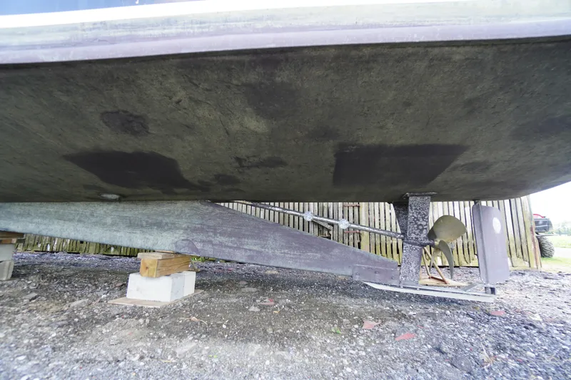 Slide: The Image of 1989 Markley 35 Ft. Deadrise boat underside, showing propeller and support structure. - 72