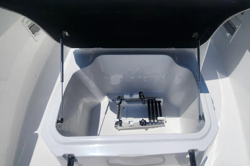 Slide: The Image of 2025 Sea Fox 268 Commander storage compartment with open lid. - 13
